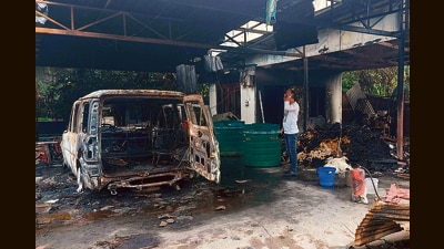 A burnt vehicle at the residence of Union minister RK Ranjan Singh in Imphal. (AFP) A burnt vehicle at the residence of Union minister RK Ranjan Singh in Imphal. (AFP)