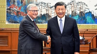 Bill Gates, left, meets with Chinese President Xi Jinping in Beijing. (AP) Bill Gates, left, meets with Chinese President Xi Jinping in Beijing. (AP)