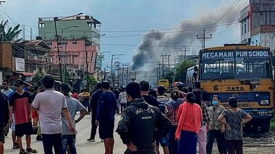 Smoke bellows from a street after a standoff between mob and security forces at Sekhon in Imphal East during ongoing ethnic violence in Manipur on June 15. (AFP) Smoke bellows from a street after a standoff between mob and security forces at Sekhon in Imphal East during ongoing ethnic violence in Manipur on June 15. (AFP)
