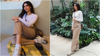 Khushi Kapoor slipped into a white full-sleeved crop top and beige high-waisted straight-leg pants. She styled the neutral-coloured ensemble with minimal accessories, including a Louis Vuitton over-the-body box bag, a dainty necklace, and statement rings. Lastly, she chose open locks, darkened brows, subtle eye shadow, mauve lips, and minimal makeup to round it all off. (Instagram) Khushi Kapoor slipped into a white full-sleeved crop top and beige high-waisted straight-leg pants. She styled the neutral-coloured ensemble with minimal accessories, including a Louis Vuitton over-the-body box bag, a dainty necklace, and statement rings. Lastly, she chose open locks, darkened brows, subtle eye shadow, mauve lips, and minimal makeup to round it all off. (Instagram)