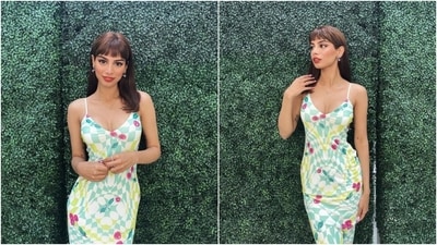 In this picture, Khushi embraces summer hues in a slip-on printed dress featuring a pastel check design and red berry patterns. She styled the maxi ensemble with dainty earrings, a sleek chain, statement rings, open locks, ruby red lips, winged eyeliner, rouged cheeks, and a dewy base. (Instagram) In this picture, Khushi embraces summer hues in a slip-on printed dress featuring a pastel check design and red berry patterns. She styled the maxi ensemble with dainty earrings, a sleek chain, statement rings, open locks, ruby red lips, winged eyeliner, rouged cheeks, and a dewy base. (Instagram)