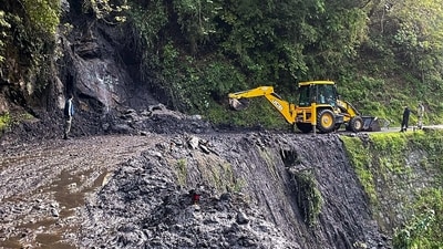 Gangtok: Army personnel clear a road that got blocked following a landslide, in Sikkim. (PTI)