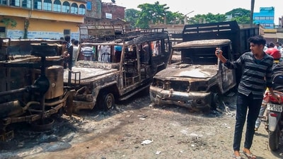 Charred remains of vehicles after clashes broke out over filing of nominations for upcoming West Bengal Panchayat polls, at Bhangore area in South 24 Parganas, on Friday. (PTI) Charred remains of vehicles after clashes broke out over filing of nominations for upcoming West Bengal Panchayat polls, at Bhangore area in South 24 Parganas, on Friday. (PTI)
