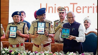 UT administrator Banwarilal Purohit and senior police officials launching the mPassport Police App on Friday. (HT File) UT administrator Banwarilal Purohit and senior police officials launching the mPassport Police App on Friday. (HT File)