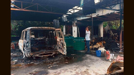 A burnt vehicle at the residence of Union minister RK Ranjan Singh in Imphal. (AFP)