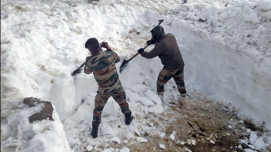 Army's Chinar Corps personnel clearing the snow from the path for the pilgrims of Amarnath Yatra, in Jammu & Kashmir on Friday. The chief executive officer (CEO) of the Shri Amarnath Shrine Board (SASB), Dr Mandeep Bhandari on Friday conducted a comprehensive tour of the Baltal axis from the base camp at Baltal to the holy cave shrine. (ANI)