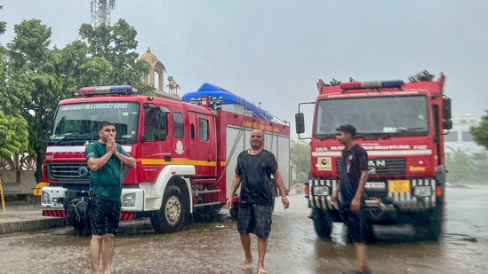 Fire department personnel prepare their equipment amid rain following the landfall of cyclone Biparjoy in Kutch.&nbsp;(PTI)