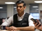 Britain's Prime Minister Rishi Sunak visits an immigration office in northwest London.