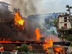 Flames and smoke billow out after an old warehouse owned by a retired bureaucrat set ablaze amid violence in Manipur, Friday, June 16, 2023. Flames and smoke billow out after an old warehouse owned by a retired bureaucrat set ablaze amid violence in Manipur, Friday, June 16, 2023.