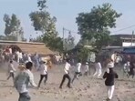 Screengrab of the video shows people pelting stones, creating ruckus at the event organised in Uttar Pradesh's Gonda district.