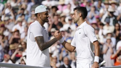 Serbia's Novak Djokovic, right, celebrates beating Australia's Nick Kyrgios in the final of the men's singles on day fourteen of the Wimbledon tennis championship (AP) Serbia's Novak Djokovic, right, celebrates beating Australia's Nick Kyrgios in the final of the men's singles on day fourteen of the Wimbledon tennis championship (AP)
