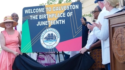 Members of the City of Galveston government unveil new signage that will be installed on the highway entering the Island to recognize its place as the birthplace of Juneteenth on Friday, June 16, 2023 in Galveston, Texas. (Elizabeth Conley/Houston Chronicle via AP) (AP) Members of the City of Galveston government unveil new signage that will be installed on the highway entering the Island to recognize its place as the birthplace of Juneteenth on Friday, June 16, 2023 in Galveston, Texas. (Elizabeth Conley/Houston Chronicle via AP) (AP)