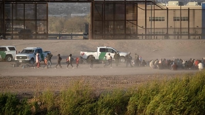 Migrants wait to be processed by United States Border Patrol seen from Ciudad Juarez, Chihuahua state, Mexico, on March 30, 2023. - Five people have been arrested over a fire at a Mexican immigration detention center near the US border that left 39 migrants dead and 27 injured, authorities said March 30, 2023. Those deaths are a reminder of the "dirty work" the country does for the United States to stem migrant flows, experts say.
Many thousands of US-bound migrants are stranded in Mexico, struggling to survive in crime-ridden border towns without jobs or resources. (Photo by Guillermo Arias / AFP) (AFP) Migrants wait to be processed by United States Border Patrol seen from Ciudad Juarez, Chihuahua state, Mexico, on March 30, 2023. - Five people have been arrested over a fire at a Mexican immigration detention center near the US border that left 39 migrants dead and 27 injured, authorities said March 30, 2023. Those deaths are a reminder of the "dirty work" the country does for the United States to stem migrant flows, experts say.
Many thousands of US-bound migrants are stranded in Mexico, struggling to survive in crime-ridden border towns without jobs or resources. (Photo by Guillermo Arias / AFP) (AFP)