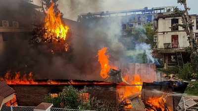 Flames and smoke billow out after an old warehouse owned by a retired bureaucrat set ablaze amid violence in Manipur, Friday, June 16, 2023. (PTI) Flames and smoke billow out after an old warehouse owned by a retired bureaucrat set ablaze amid violence in Manipur, Friday, June 16, 2023. (PTI)