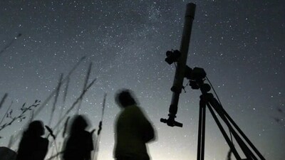 People gaze at the sky. (AP) People gaze at the sky. (AP)