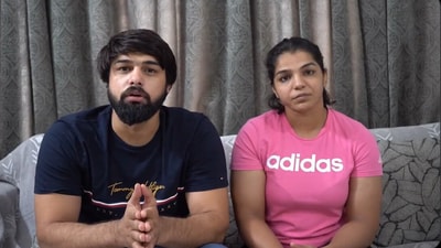 Olympic medalist Sakshee Malikkh, and wrestler and her husband Satyawart Kadian.