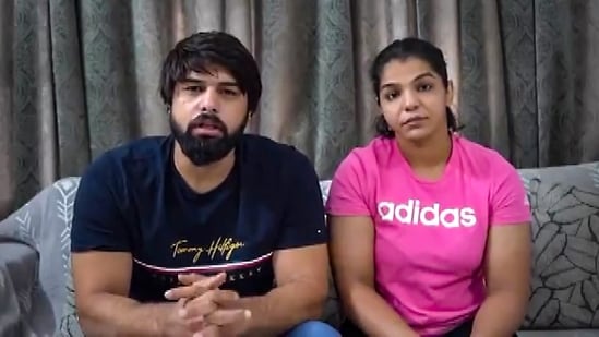 Wrestlers Satyawart Kadian and Sakshi Malik speaks during a video message on Saturday (PTI)