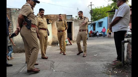 Police at crime spot at Warje in Pune, on Saturday. In a daylight firing incident, three bike-borne assailants opened fire and injured a 21-year-old youth in Warje-Malwadi. (PRATHAM GOKHALE/HT)