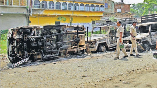 South 24 Parganas, June 16 (ANI): Police personnel stand guard at the incident site where violent clashes erupted during the filing of nominations for the upcoming West Bengal Panchayat elections, at Bhangar in South 24 Parganas on Friday. (ANI Photo) (Shyamal Maitra)