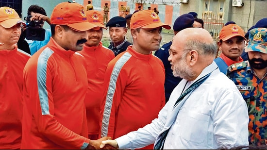 Union home minister Amit Shah meets NDRF personnel in Gujarat on Saturday. (ANI)