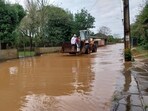 A family crosses a flooded street on a loader in the city of Novo Hamburgo, Rio Grande do Sul State, after an extratropical cyclone hit the southern region of Brazil. A family crosses a flooded street on a loader in the city of Novo Hamburgo, Rio Grande do Sul State, after an extratropical cyclone hit the southern region of Brazil.