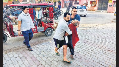 An elderly man is carried to a hospital in Ballia on Sunday. (AP)