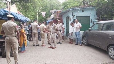 Delhi Police near the crime scene. Delhi Police near the crime scene.