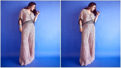 For her stunning look, the actress donned a fashionable jumpsuit from the fashion brand Nupur Kanoi. The chic ensemble comes with a notable price tag of 46K, reflecting the exclusivity and craftsmanship. (Instagram/@mohitrai) For her stunning look, the actress donned a fashionable jumpsuit from the fashion brand Nupur Kanoi. The chic ensemble comes with a notable price tag of 46K, reflecting the exclusivity and craftsmanship. (Instagram/@mohitrai)