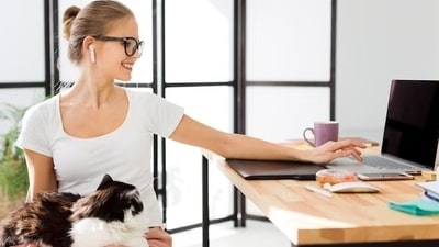 Once in a while, it's fun to take your cat to office to not just introduce them to your colleagues but also let them know where you vanish for those 8-10 hours from home. (Freepik) Once in a while, it's fun to take your cat to office to not just introduce them to your colleagues but also let them know where you vanish for those 8-10 hours from home. (Freepik)