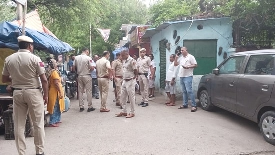 Delhi Police near the crime scene.
