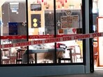 Police tape cordons off a restaurant in Auckland, New Zealand, Tuesday, June 20, 2023, after an axe attack late Monday. Police tape cordons off a restaurant in Auckland, New Zealand, Tuesday, June 20, 2023, after an axe attack late Monday.
