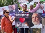 Indian community members hold posters of Prime Minister Narendra Modi during Unity rally, ahead of his visit to the US, in Washington.