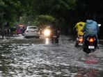 Motorcyclists drive past the waterlogged Rajiv Gandhi IT Expressway after rainfall, in Chennai. Motorcyclists drive past the waterlogged Rajiv Gandhi IT Expressway after rainfall, in Chennai.