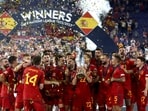 Spain's Jesus Navas lifts the trophy with teammates after winning the UEFA Nations League final