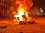 Tyres and construction materials set on fire by miscreants amid ongoing ethnic violence in Manipur, in Imphal East district, Friday. (PTI)
