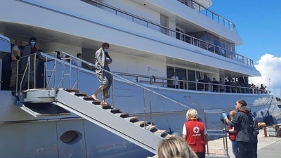 Survivors arrive after a rescue operation at the port in Kalamata town, about 240 kilometers (150miles) southwest of Athens. (AP)