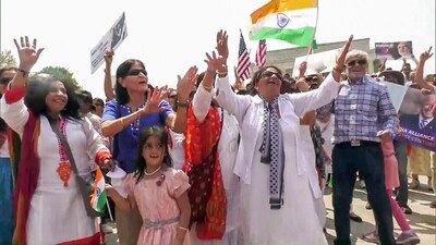 People from the Indian American diaspora dance in joy as they hold a unity rally ahead of Prime Minister Narendra Modi's historic visit to the United States, in Washington on Monday. (ANI ) People from the Indian American diaspora dance in joy as they hold a unity rally ahead of Prime Minister Narendra Modi's historic visit to the United States, in Washington on Monday. (ANI )
