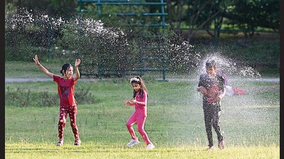 Children frolicking in the sprinklers at Rose Garden in Sector 16, Chandigarh, on a sultry Monday afternoon. (Ravi Kumar/HT)