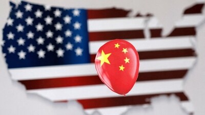 Chinese Spy Balloon: A printed balloon with Chinese flag is placed on a US flag in the shape of US map outline, in this illustration. (Reuters)
