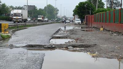 Gurugram, India-June 19, 2023: A view of damage service road of National Highway-48 near Khandsa village; To ensure that repair and maintenance of the highways due to potholes or cracks or other reasons is taken up immediately, the NHAI has delegated financial powers to the local officers ranging from ₹10 lakh to ₹25 lakh respectively, in Gurugram, India, on Monday, 19 June 2023. (Photo by Parveen Kumar/Hindustan Times)(Pic to go with Abhishek Behl's story) Gurugram, India-June 19, 2023: A view of damage service road of National Highway-48 near Khandsa village; To ensure that repair and maintenance of the highways due to potholes or cracks or other reasons is taken up immediately, the NHAI has delegated financial powers to the local officers ranging from ₹10 lakh to ₹25 lakh respectively, in Gurugram, India, on Monday, 19 June 2023. (Photo by Parveen Kumar/Hindustan Times)(Pic to go with Abhishek Behl's story)