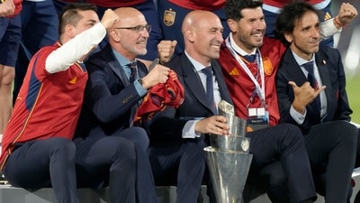 Spain coach Luis de la Fuente, 2nd left, poses with the trophy after winning the Nations League final match between Croatia and Spain at De Kuip stadium (AP) Spain coach Luis de la Fuente, 2nd left, poses with the trophy after winning the Nations League final match between Croatia and Spain at De Kuip stadium (AP)