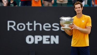 Britain's Andy Murray celebrates with the trophy after winning the Nottingham Open in the final against France's Arthur Cazaux (REUTERS)
