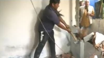 Bhopal local administration personnel razed the house of accused Sameer Khan. (ANI/Twitter)