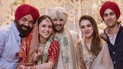 Karan Deol's real brother Rajveer Deol and cousin Aryaman Deol (son of Bobby Deol) also joined him at the wedding and were seen distributing sweets to the paparazzi. Karan Deol's real brother Rajveer Deol and cousin Aryaman Deol (son of Bobby Deol) also joined him at the wedding and were seen distributing sweets to the paparazzi. 