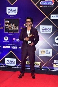 Rajkummar Rao exuded elegance and style in a purple striped suit. (HT photo/VarinderChawla)
