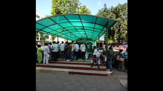People waiting to get an OPD ticket at the Lari Cardiology in Lucknow on Monday (HT Photo)