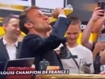Screengrab from the viral video showing French President Emmanuel Macron chugging a beer bottle. Screengrab from the viral video showing French President Emmanuel Macron chugging a beer bottle.