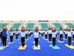 Participants perform yoga on the eve of 'Yoga Mahotsav 2023', at Major Dhyan Chand National Stadium in New Delhi on Tuesday. Participants perform yoga on the eve of 'Yoga Mahotsav 2023', at Major Dhyan Chand National Stadium in New Delhi on Tuesday.
