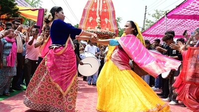 Female devotees engage in Rath Yatra festivities. In this picture, people are also seen capturing them on their mobile phones. (HT Photo/Keshav Singh) Female devotees engage in Rath Yatra festivities. In this picture, people are also seen capturing them on their mobile phones. (HT Photo/Keshav Singh)