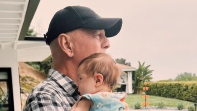 The photos show Bruce Willis lovingly holding eight-week-old Louetta (rumerwillis/Instagram)